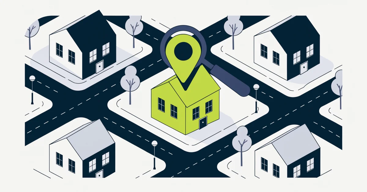 Neighborhood of houses seen from above with one green-roofed house under a magnifying glass and location pin