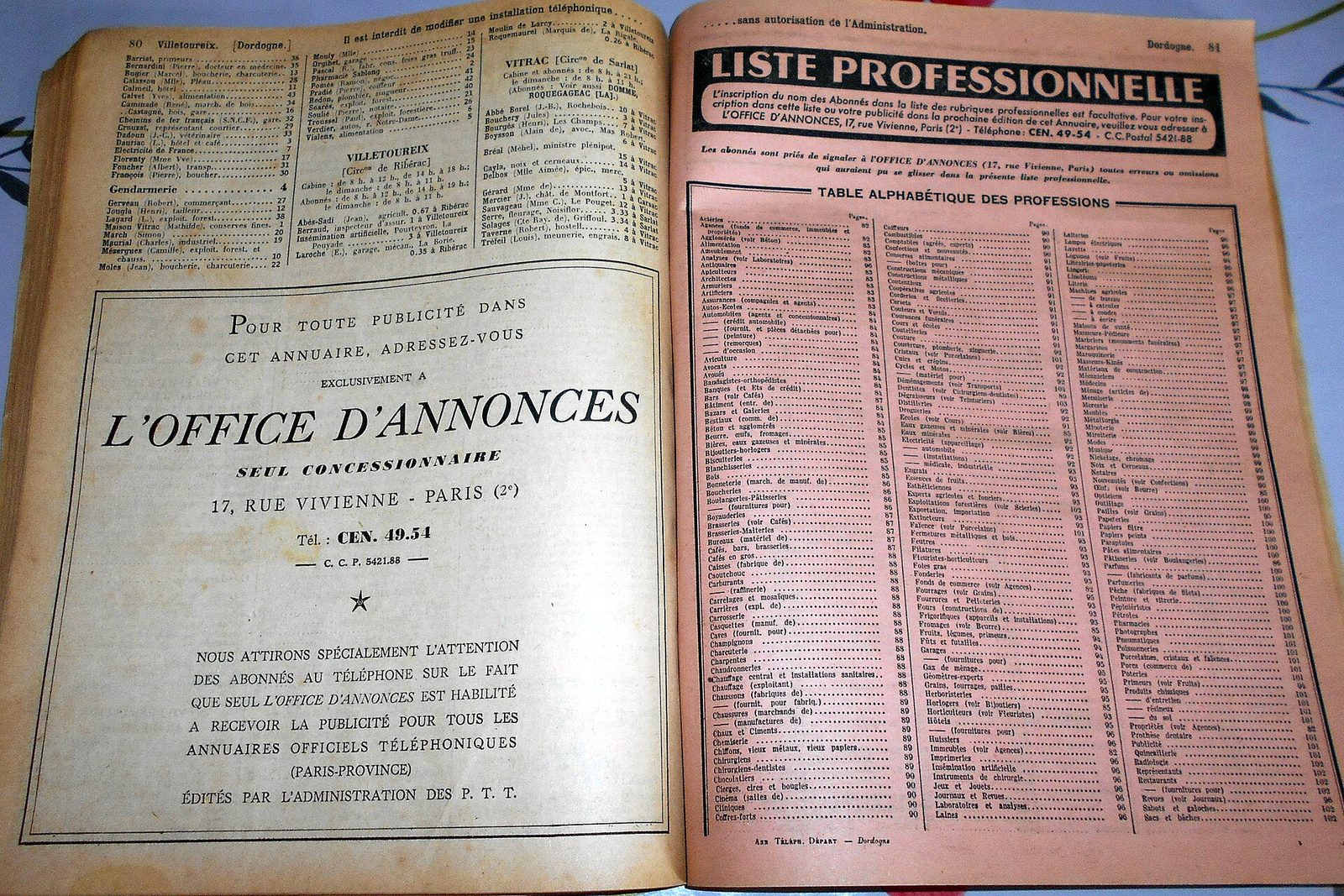 A vintage printed telephone directory lying open to its business listings
